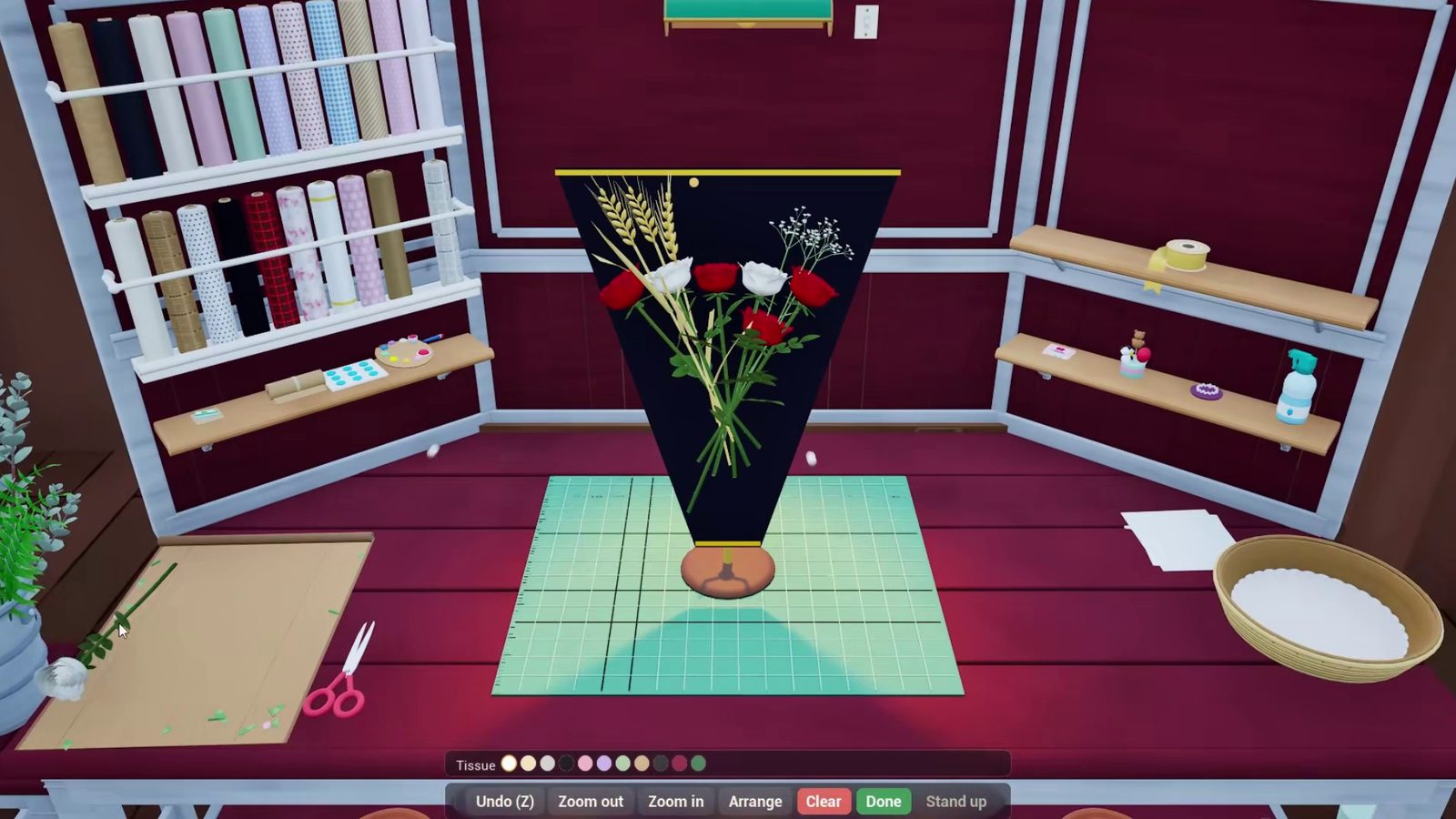 Arranging red and white roses with golden wheat in black wrapping paper